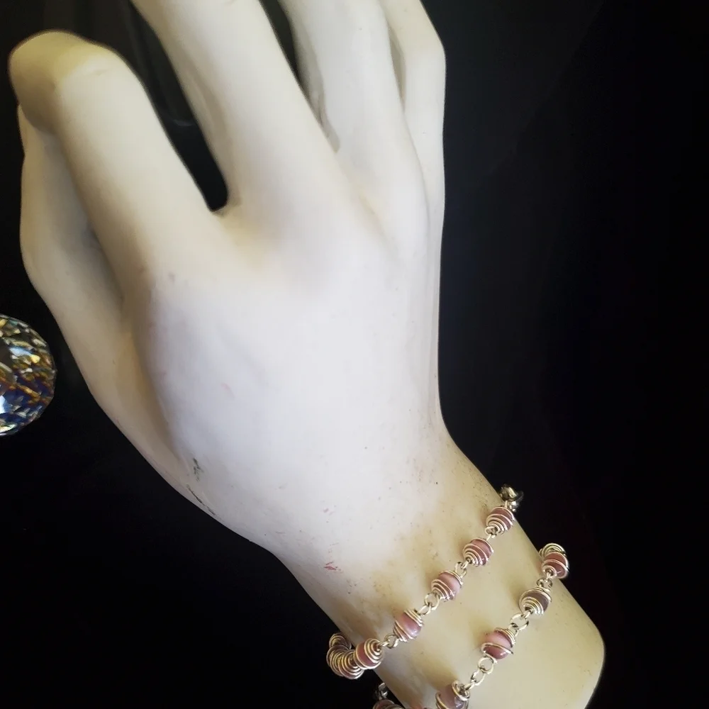 Two silver with pink pearl stones